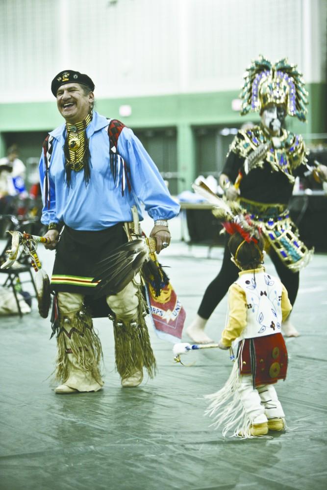 GVL / Kyle A. Hudecz
Performers dance a traditional woodland dance to the sound of drums and singing at the Spring Pow Wow held by the Native American Student Association  in the fieldhouse arena on Saturday.