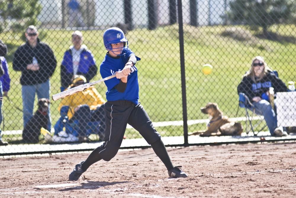 Sophomore Carli Raisutis swings at a pitch during the Laker’s home-opener against Olivet.