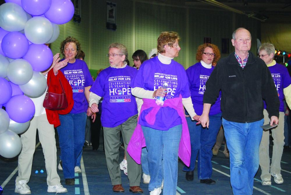 GVL/ Katie Mitchell
Surviors take the first laps around the track to kick off Relay for Life.