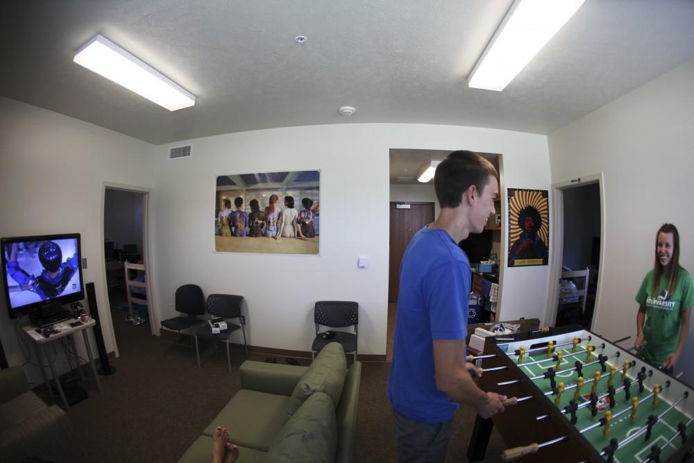 Friends Austin McCloe and Ashley Steponski play foosball in the new spacious living centers.