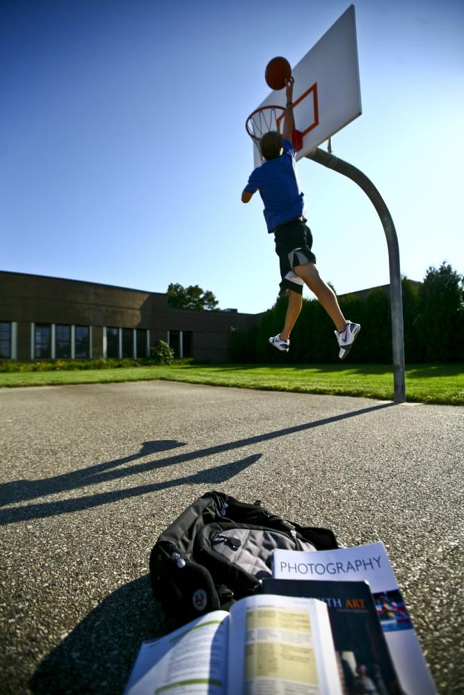 Michael Stave, both a student and an intramural basketball player, has to find time to balance both academics and sports.