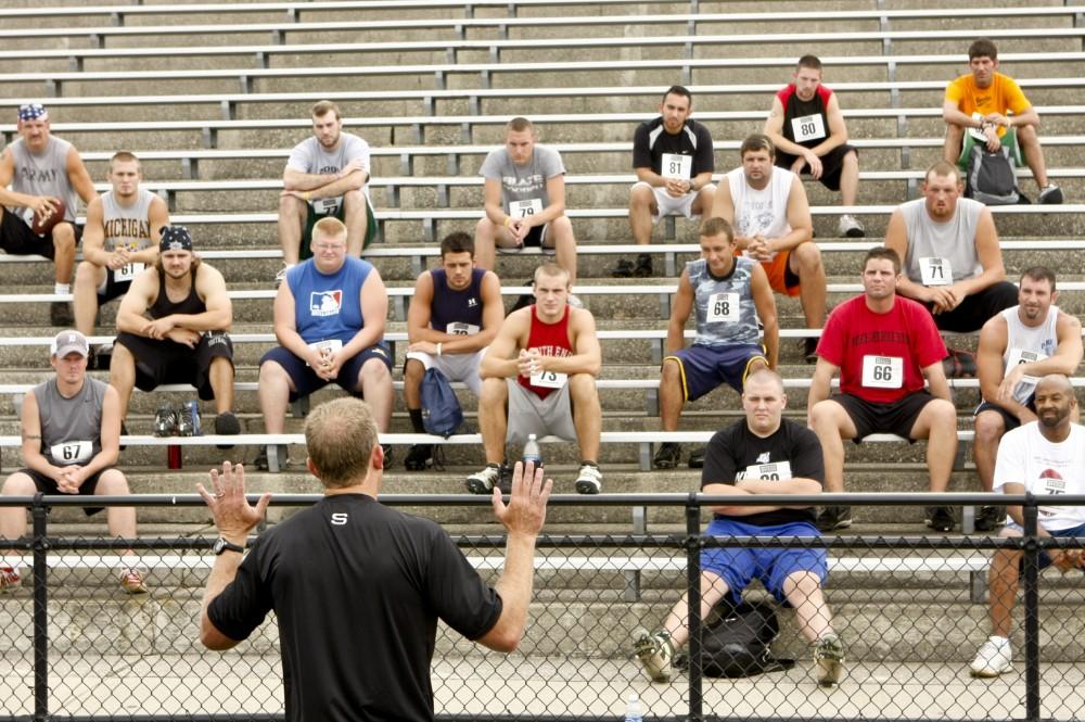 Mark Ellis addresses a group of hopeful football players before their tryouts for "Touchback."