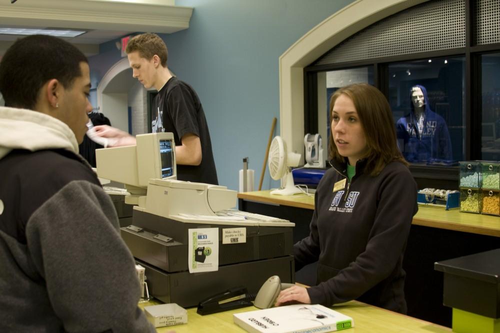 GVL Archive / Matt LaVere
Junior Megan Nadolny from Chelsea, MI rings up students at the cash register in the UBS.