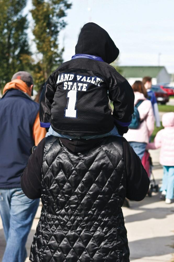 GVL Archive/ Eric Coulter
A Lil Laker takes cathes a ride during the parade that took place at last year's homecoming