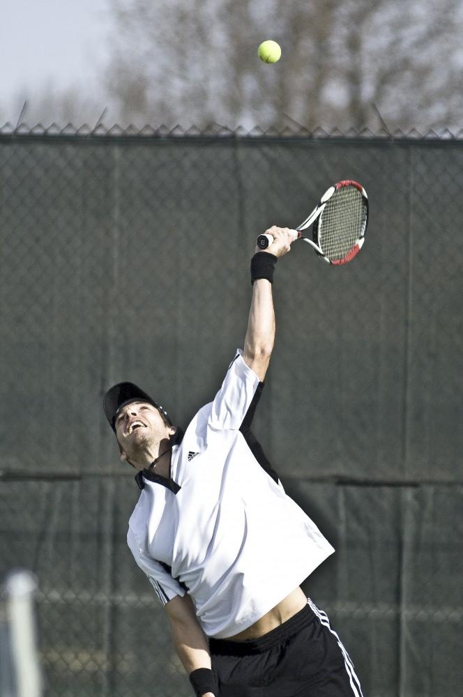 Grand Valley sophomore Marc Roesslein hits a serve during Friday’s match against Wayne State.