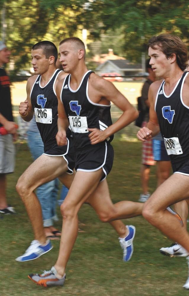 GVSU mens cross country runners Robbie Young, Christopher Pabst, and Grant Fall stick together during the Aquinas Open last Friday.  The meet was held at Riverside Park in Grand Rapids.