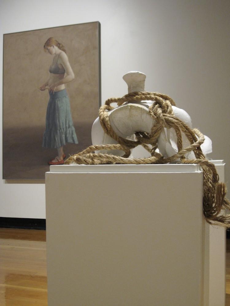 Courtesy Photo / Paris Tennenhouse
Image from MultiMedia I exhibition showing: Anna Campbells, Saddedstair, plaster and rope, 2007 and Ed Wong Ligdas, Lily Injecting Fertility Drug oil on canvas, 2009.