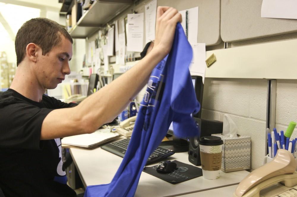 GVL / Eric Coulter
Ryan Comeau inspects a UBS clothing item, making sure that none of the clothes in the UBS are made in sweat shops