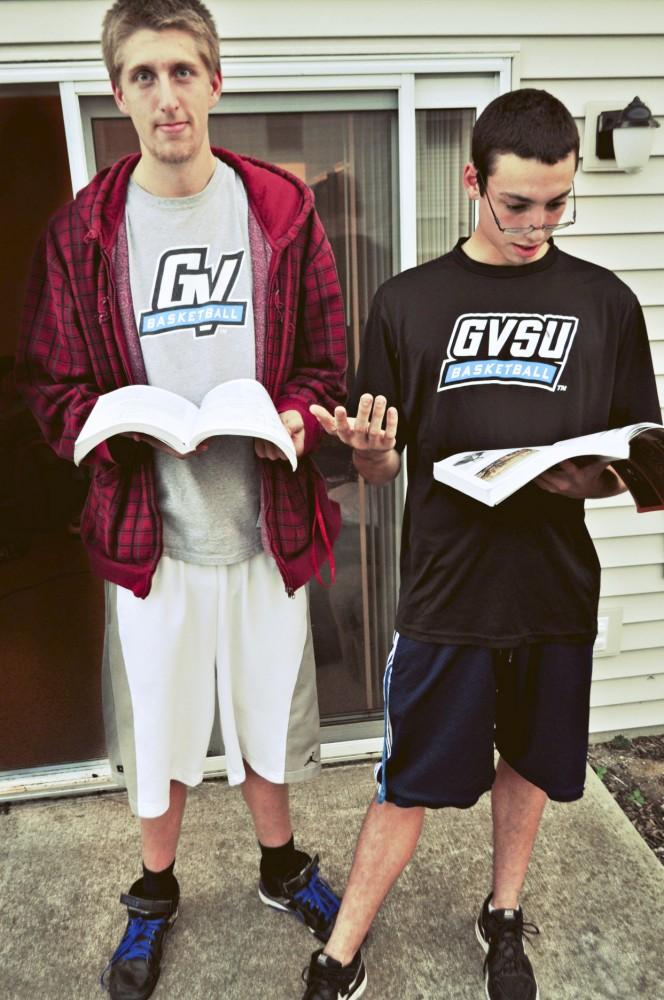 Corey Jones and Danny Newell, members of the Grand Valley Basketball team, take time out of their schedules to study.