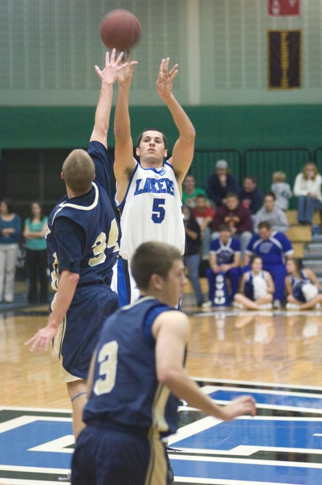 GVL Archive / Andrew Mills
Nick Carreri shoots the ball outside of the arc during a past game. 