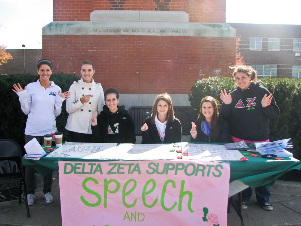 Delta Zeta Sorority sitting by the clock tower for Disability Awareness Week