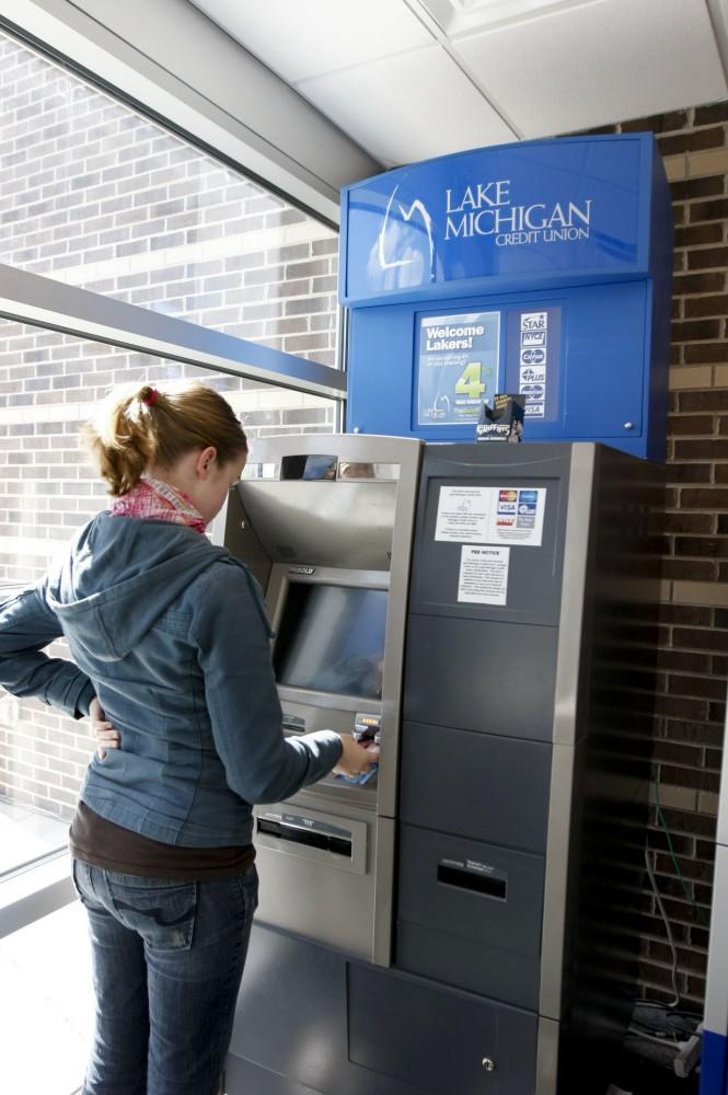 GVSU student Ellen Lundgren uses the Lake Michigan ATM in the Kirkhof center