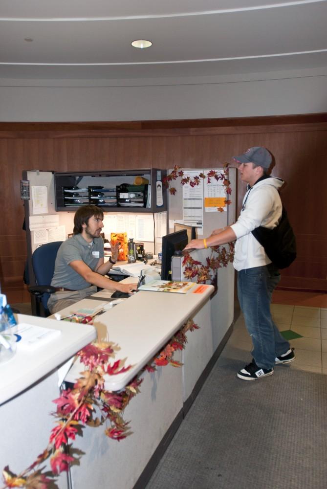 Junior sports management major Josh Schutt asks for grant information in the Financial Aid office.