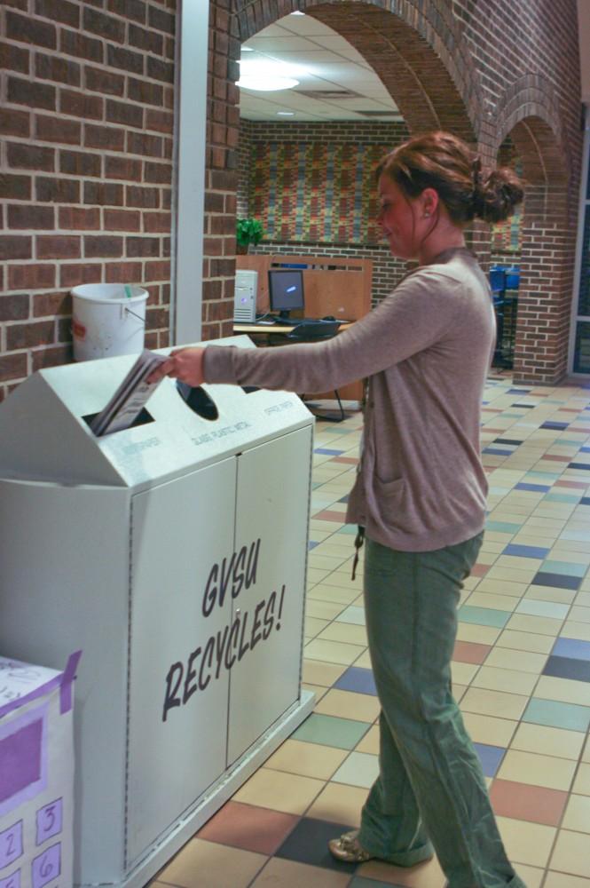 Cortney Kittridge takes advantage of the on-campus recycling bins