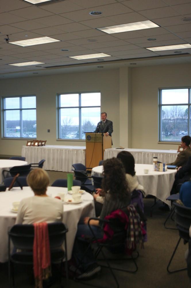 President Haas speaks with students and faculty at the Sustainability Champions Breakfast