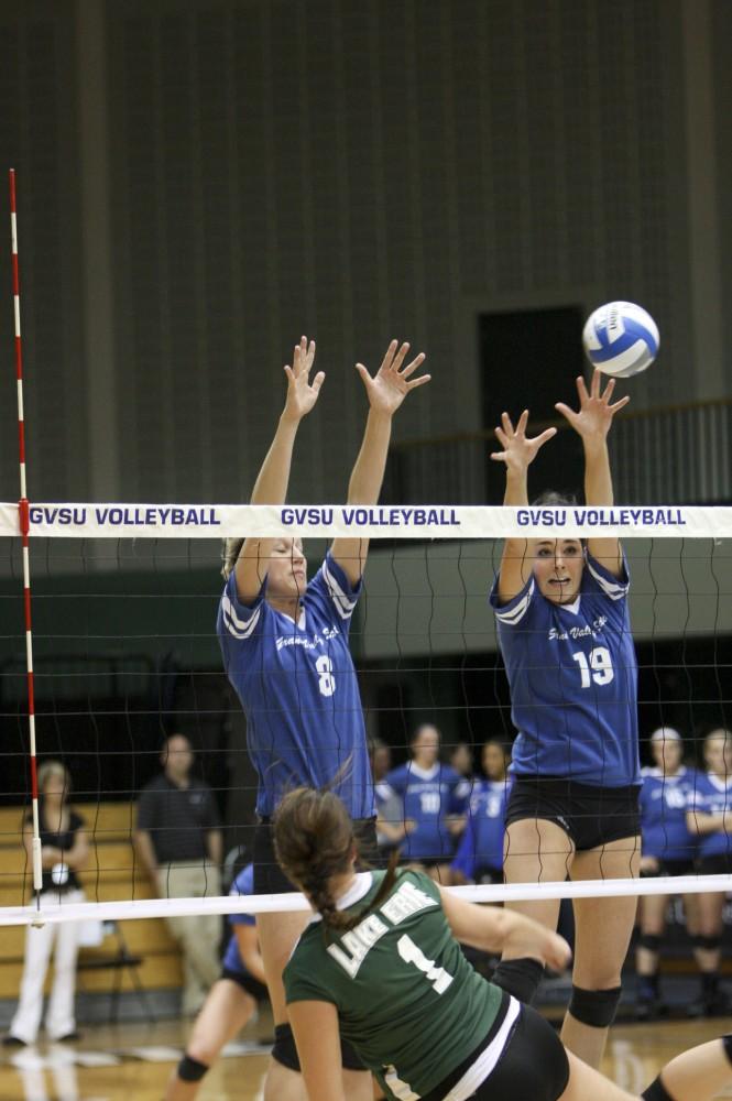 Nicole Whiddon and Rebecca Rapin block a shot from Lake Erie on Friday