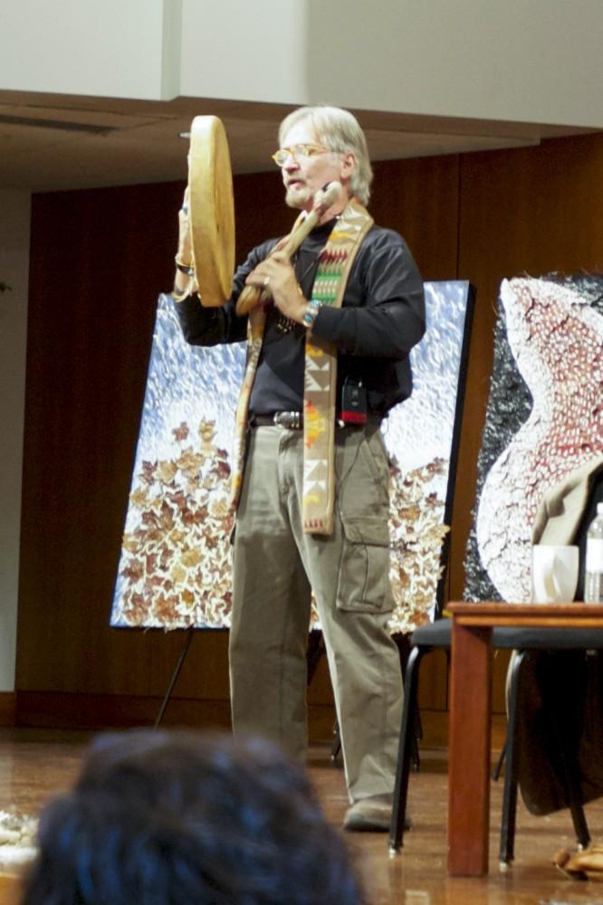 C. Michael Smith, Ph.D, preforms a chant before beginning his lecture Why Shamanism Now? last Wednesday.