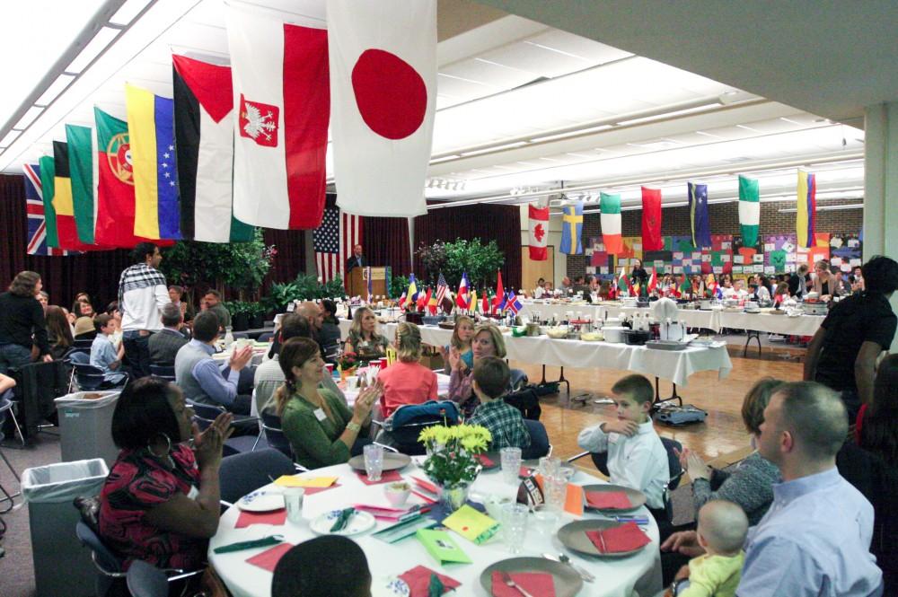 Participants at the International Reception listen to a speaker