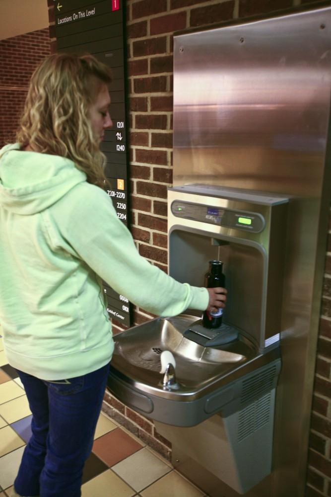 GVL / Nathan Mehmed
Amber Hendrick uses the water bottle filling station located in Kirkhof. The aim is to keep GVSU sustainable