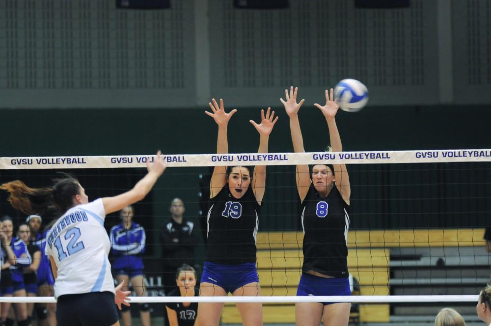 Sophomore Olivia Kohler sets the ball for a spike during the Lakers third set against Northwood University.