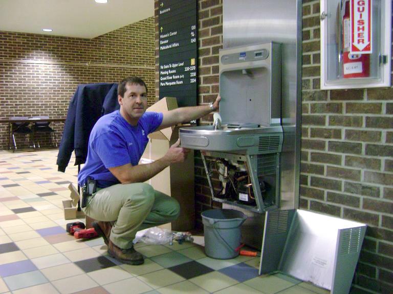 Courtesy Photo / David Feenstra
Cristopher Jefferies intalls the new water bottle filling stations in the Kirkhof lobby.