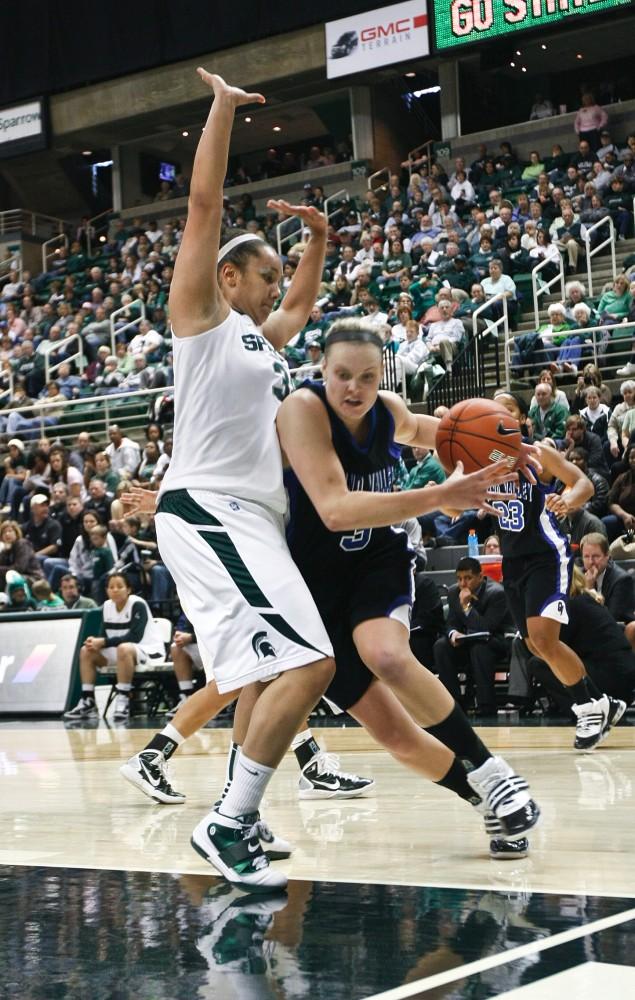 GVL Archive / Eric Coulter
Sophomore Jessica Trambley tries to run past an opponent during the game aainst Michigan State. GV beat Urbana 73 - 67 this weekend