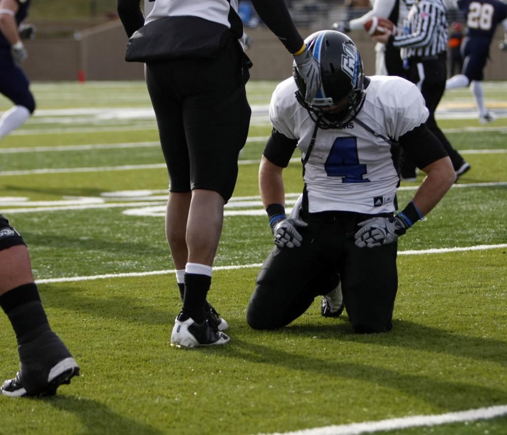 Senior running back reacts after fumbling in the second quarter of Saturdays NCAA playoff loss to Augustana College.