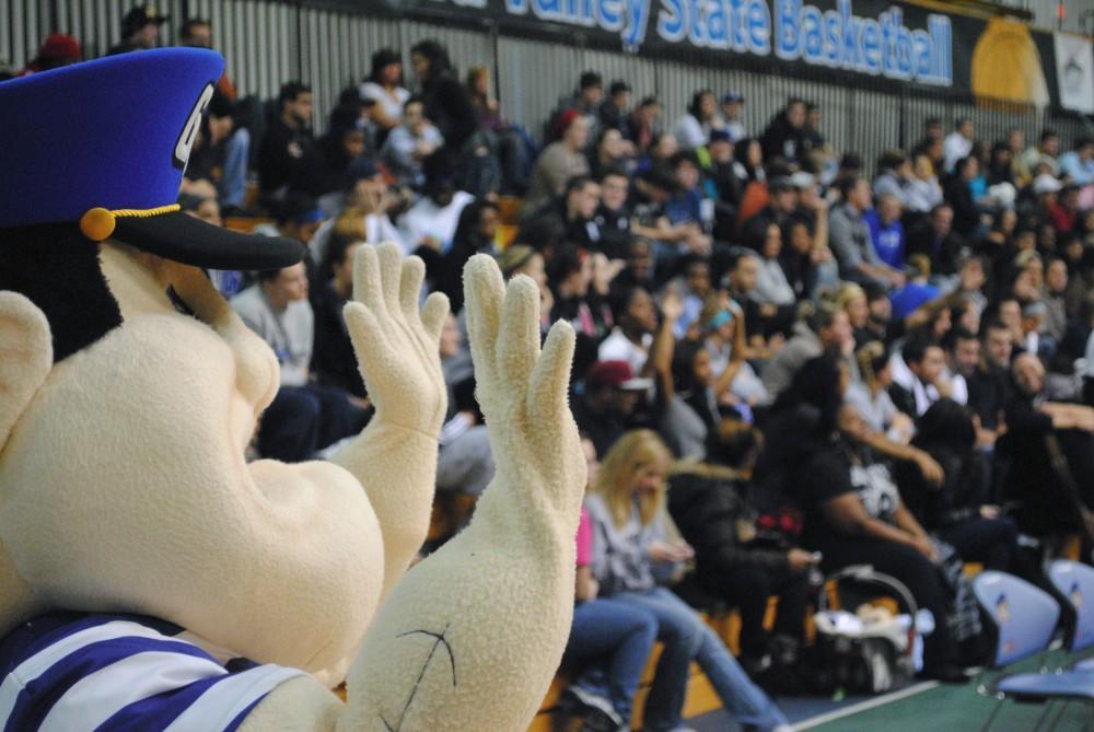 Louie the Laker leads the crowd in 'spirit fingers' during free thows at the home game on Monday against Olivet College.