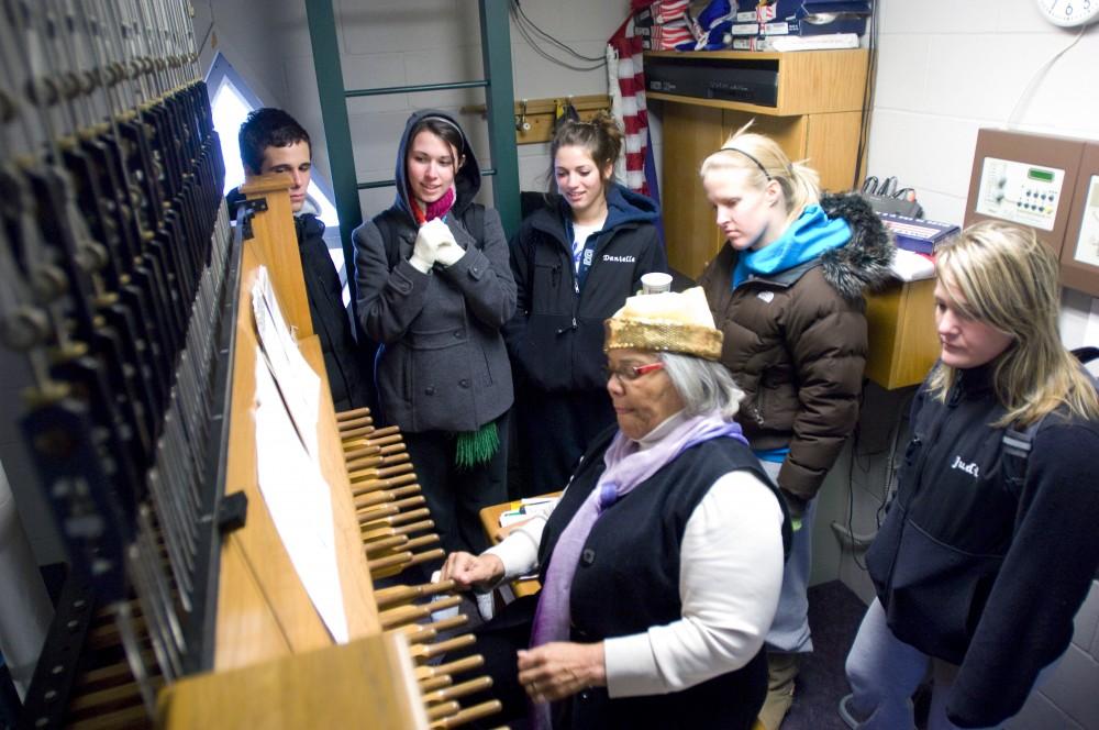 GVL Archive /Andrew Mills
Judi Jaekel, Karly Dierkes, Danielle Perkins, Colleen MacCallan, and Brandon Harneck (R to L) listen to Julianne Vanden Wyngaard, the university carillonneur performing inside of the Cook Carillon Tower
