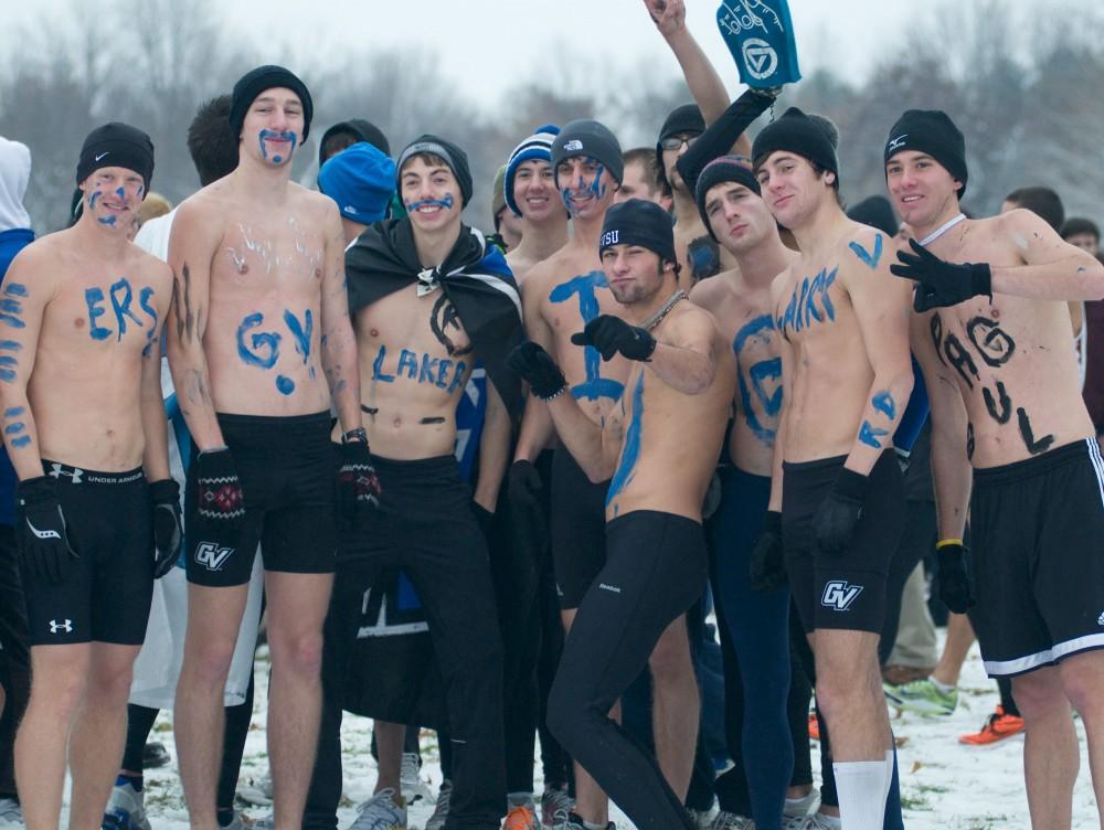 Part of the mens cross country team celebrate after the race