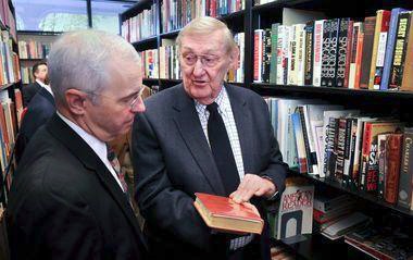 Courtesy Photo / mlive.com
Donald Markle, a contributor to the Haunstein Center, discusses a book he donated to GVSU