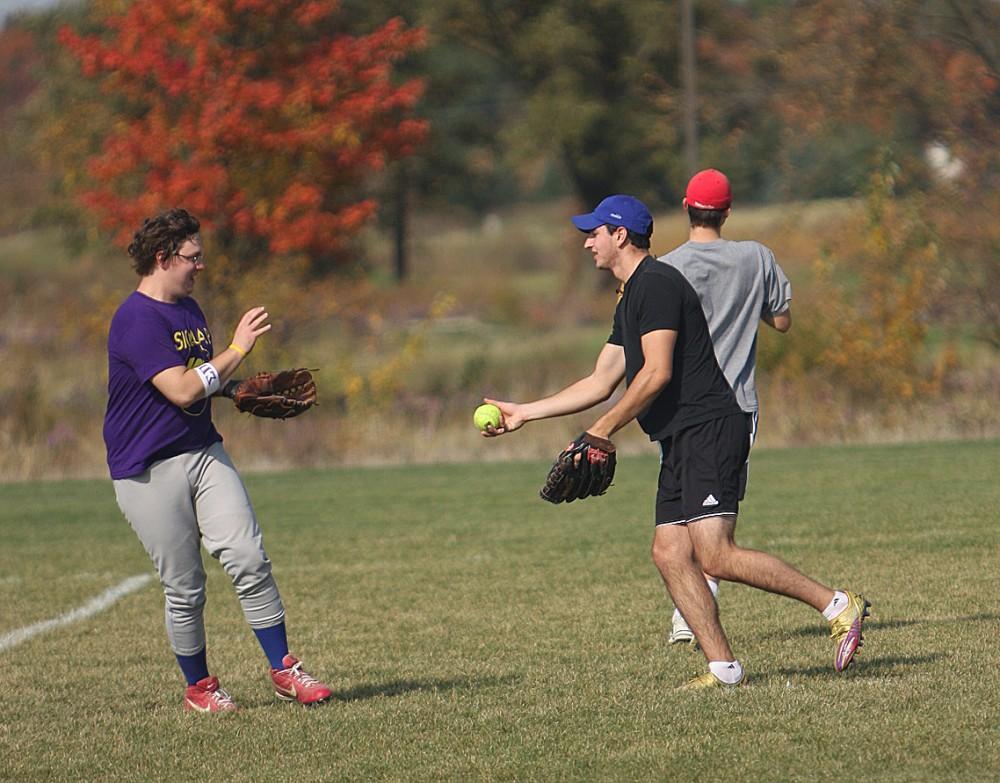 Students play in an intramural softball match