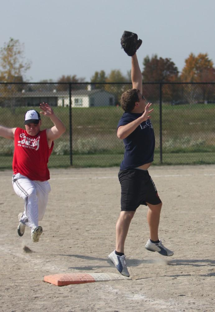 Students participate in an intramural softball match