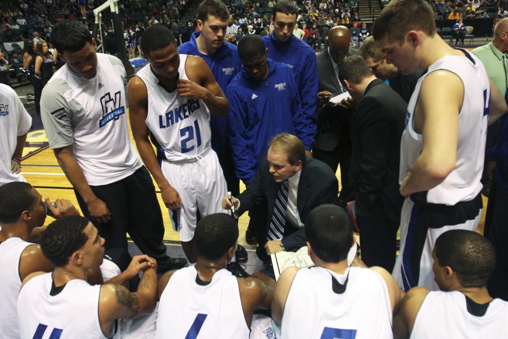 Head coach Ric Wesley talks to the team during a time out