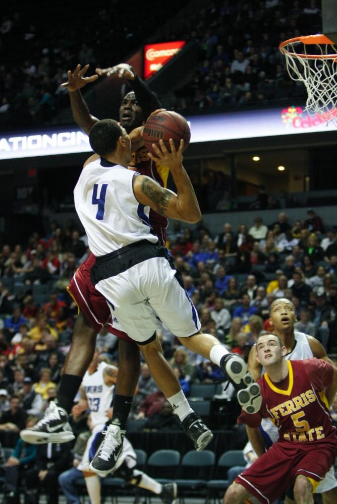 Junior James Thomas lunges towards the basket