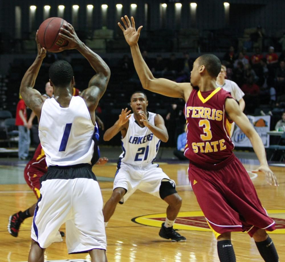 Tony Peters anticipates a pass from his teammate Breland Hogan