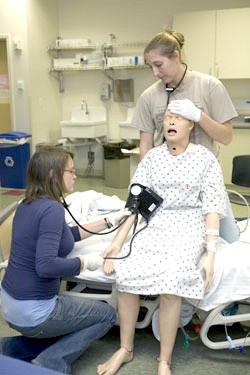 Courtesy Photo / gvsu.edu
Grand Valley State University students practice on a medical mannequin in the Simulation and Learning center.