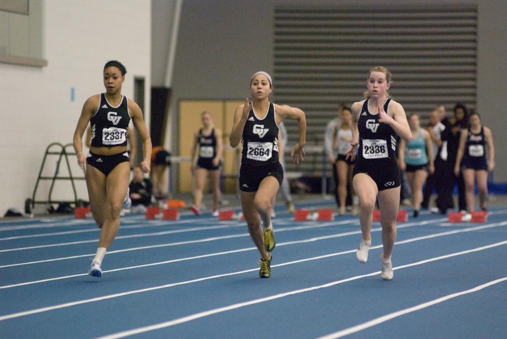 Brooke Horne, Serena Black, and Olivia Holwerda (L-R) compete in the 60m dash during during a past home meet at the Laker Turf Building.