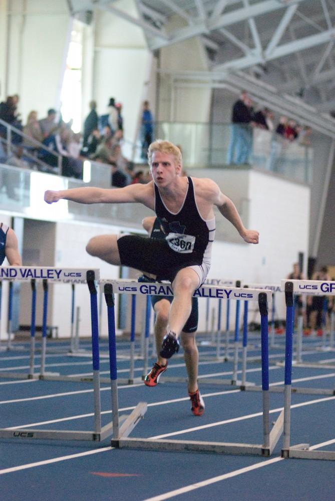 Ryan Brown competes in the 60m hurdles during a past home meet at the Laker Turf Building.