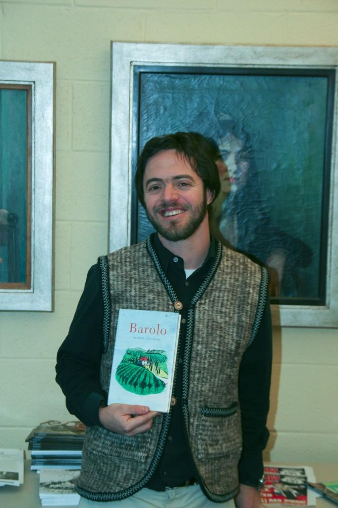 Matthew Frank poses with his new book, Barolo