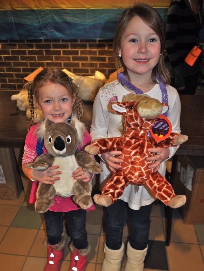 Little Lakers show off their new stuffed animals they made at Sibs and Kids Weekend