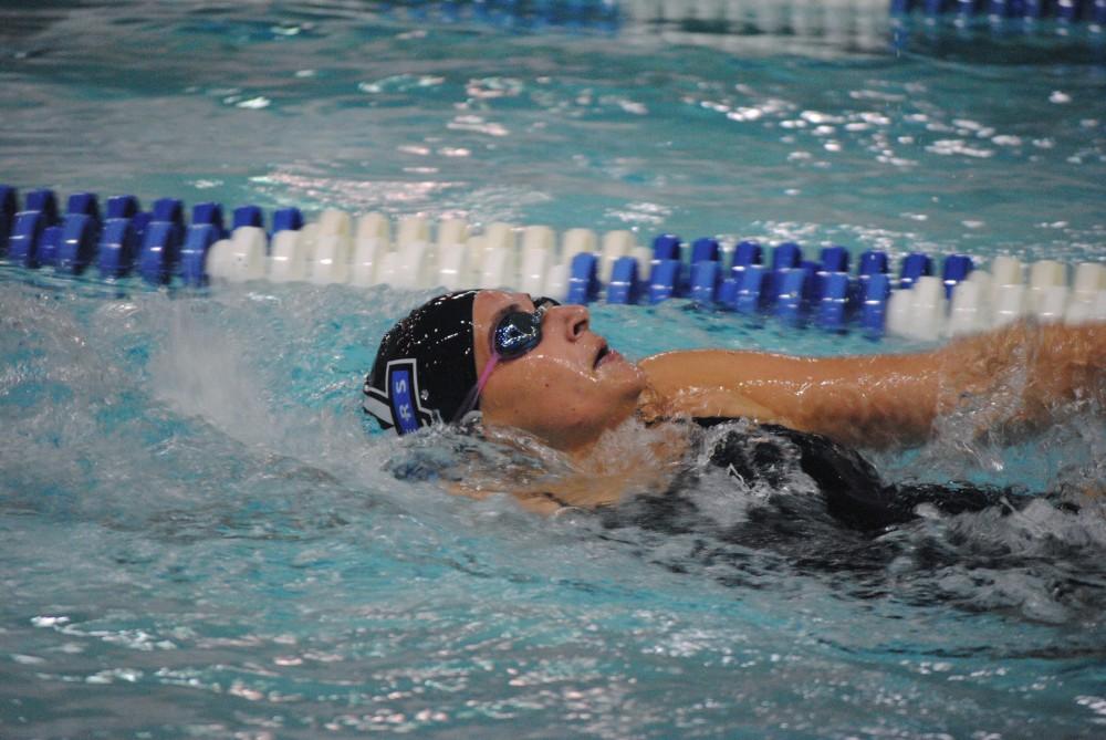 Freshman Ellen Wiese preforms the backstroke during the 400 yard IM at the Lakers swim meet against the Univerisity of Indianapolis.