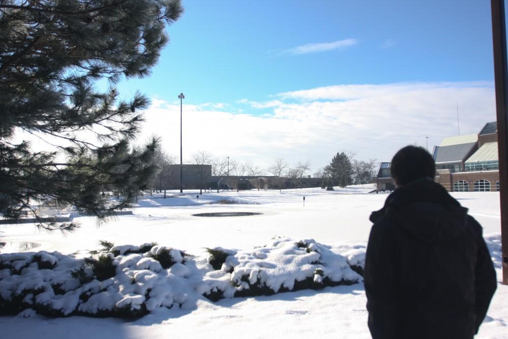 James Dean looks out over an empty and snow covered campus