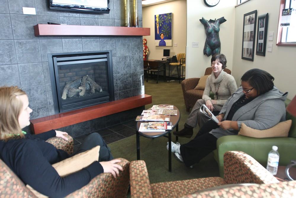 Ashley Nickels, Theresa Rowland, and Jenika Townsel take a break from work in the comfortable Women's Center lounge. 