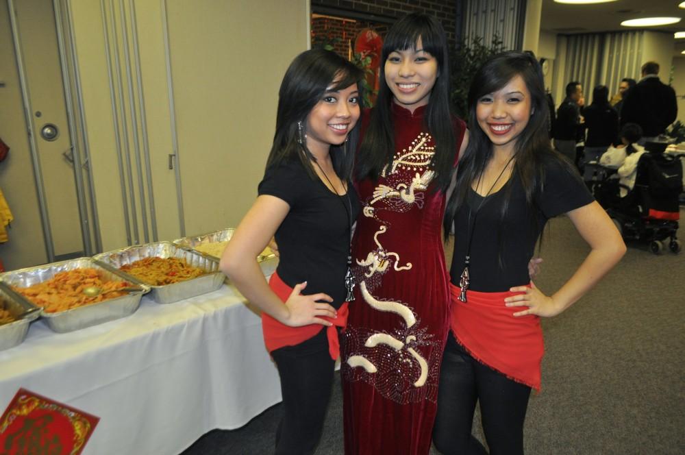 Lan Huynh, Linda Truong, and Linda Teng, members of Delta Phi Lambda, pose for a picture at the Asian Pacific Heritage Celebration