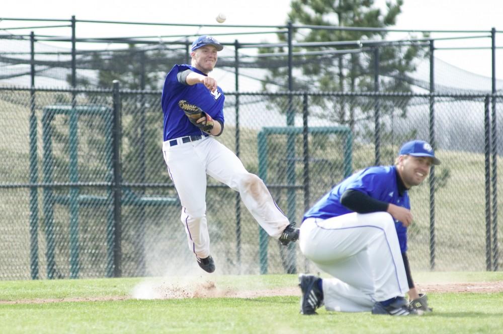 GVL Archive / Andrew Mills
Grand Valley State University third baseman Dan Ponegalek throws the ball to first during a past game