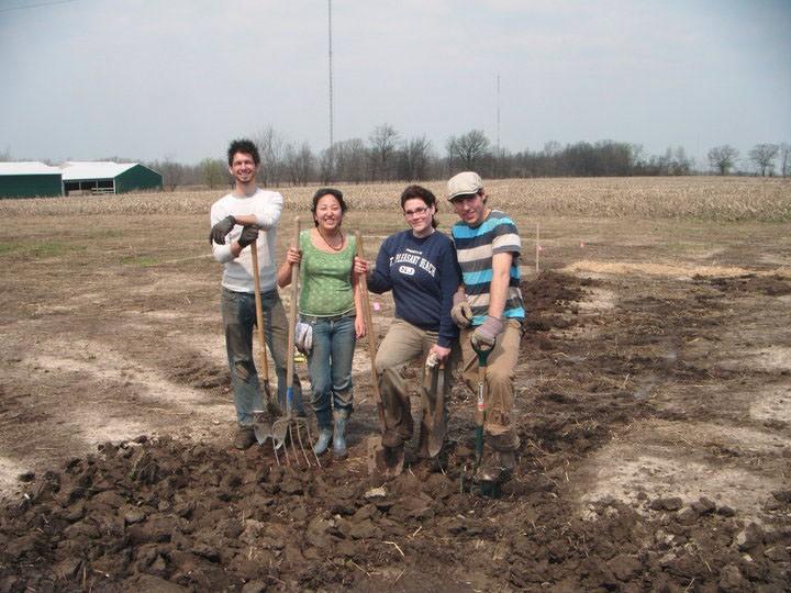 Courtesy Photo / Levi GardnerLevi Gardner (left) stands with Grand Valley students Amy Page, Kendall Gilbert, and Josh Lycka last spring while breaking ground on the community garden. 
