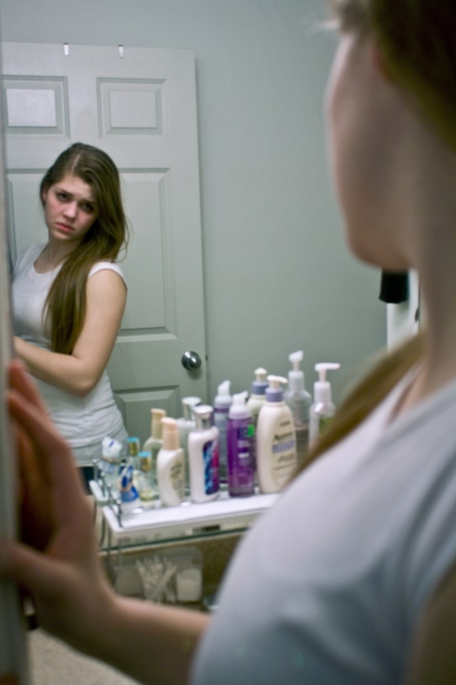 Image issues: A Grand Valley student examines her reflection. Conversations on Loving Your
Body event will focus on the body image issues that plague many students, faculty, and staff.