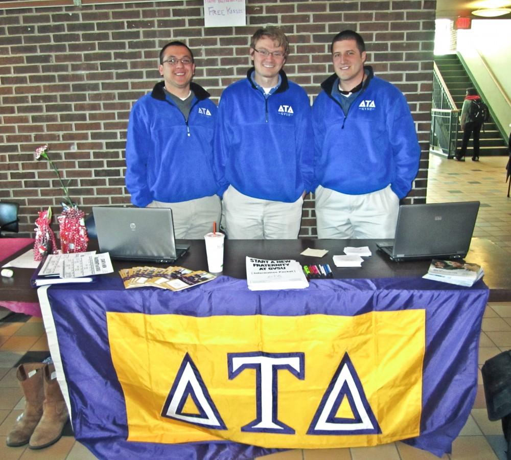 Chapter leadership consultants Matthew Munoz, Shane Vaughn, and Jake Johnson set up a booth in Kirkhof to recruit new members for the Delta Tau Delta fraternity
