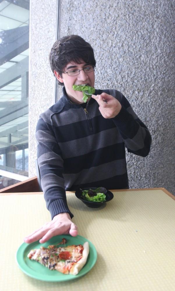 Junior Jake Espinoza rejects pizza for a healthier alternative. On campus food has many different options for heath consious students